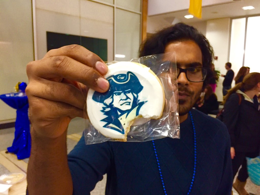 Parth taking a bite out of <a href="/GWtweets/">GW University</a>! #GWSB Senior Appreciation Night!