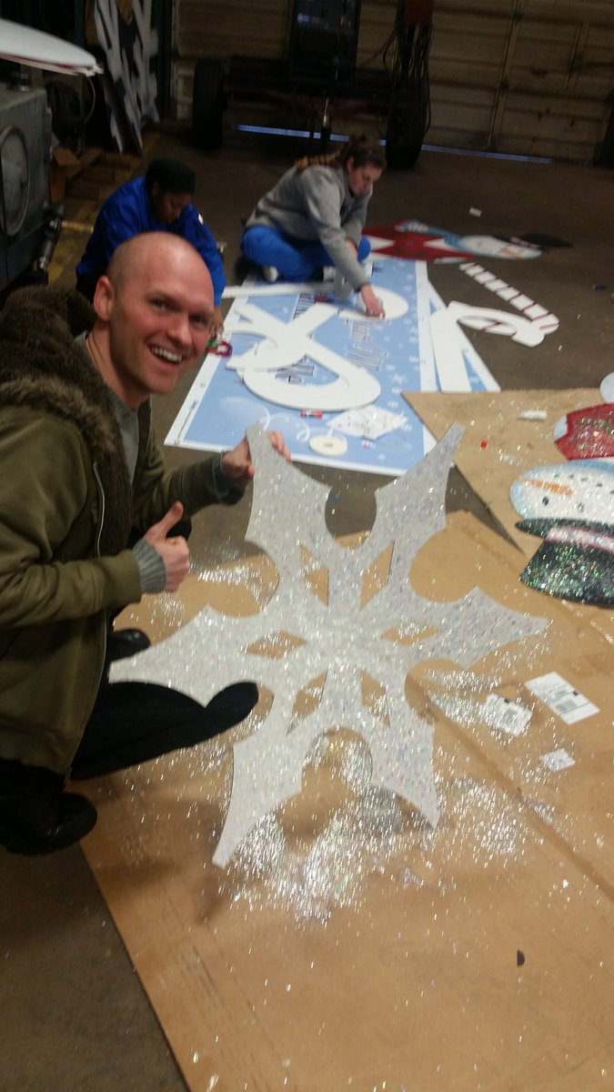 Our Secretary sparkling up this snowflake for the Christmas parade!