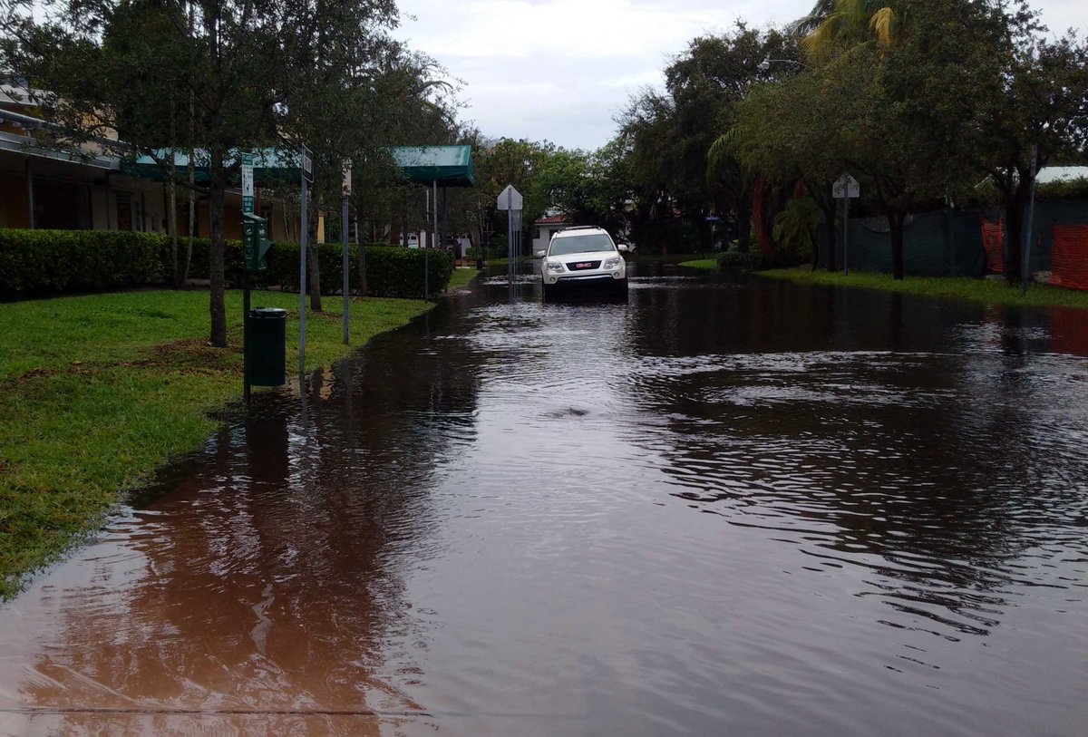 keybiscayne's tweet photo. How flooded are we? This is the entrance to the elementary school. #SoFLDeluge #SendAnArk #NoWakeZone https://t.co/kcIecqGdm4