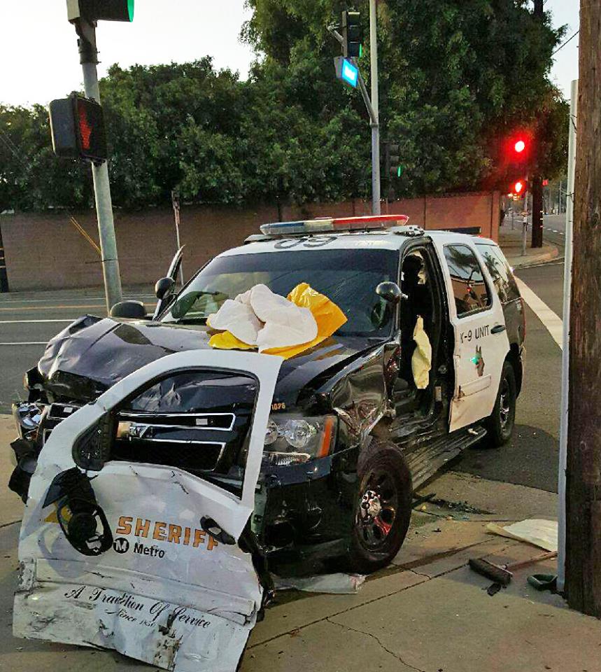 eCommLASD's tweet image. #LASD deputy cut from vehicle after being struck by felony #DUI suspect. Both deputy and his #K9 partner are ok