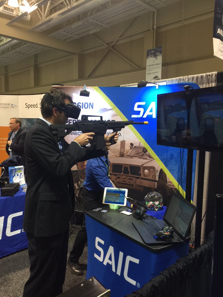 TEK_CFrench's tweet photo. @josop30 on the #OculusRift at the @SAICinc booth at the @C5ISRCON. @TEKsystems https://t.co/F4yDrH66SQ