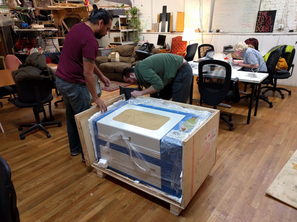 HackCambridge's tweet photo. Unwrapping the laser cutter @DrBruceJones @foundersIO @JCMorales82 https://t.co/icyUAqnOZo