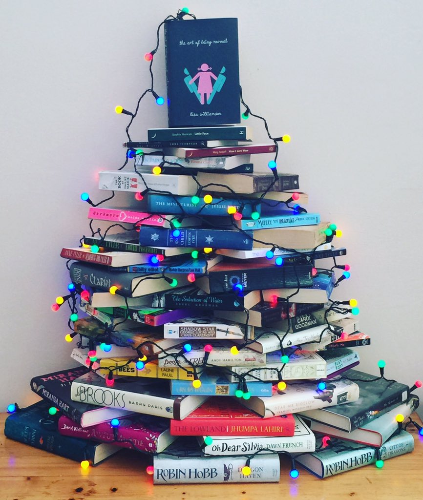 JamesENicol's tweet photo. My #BookChristmasTree ! bit wonky but I LOVE it! @lisa_letters #artofbeingnormal is the Angel on top! https://t.co/L541FxZJWk