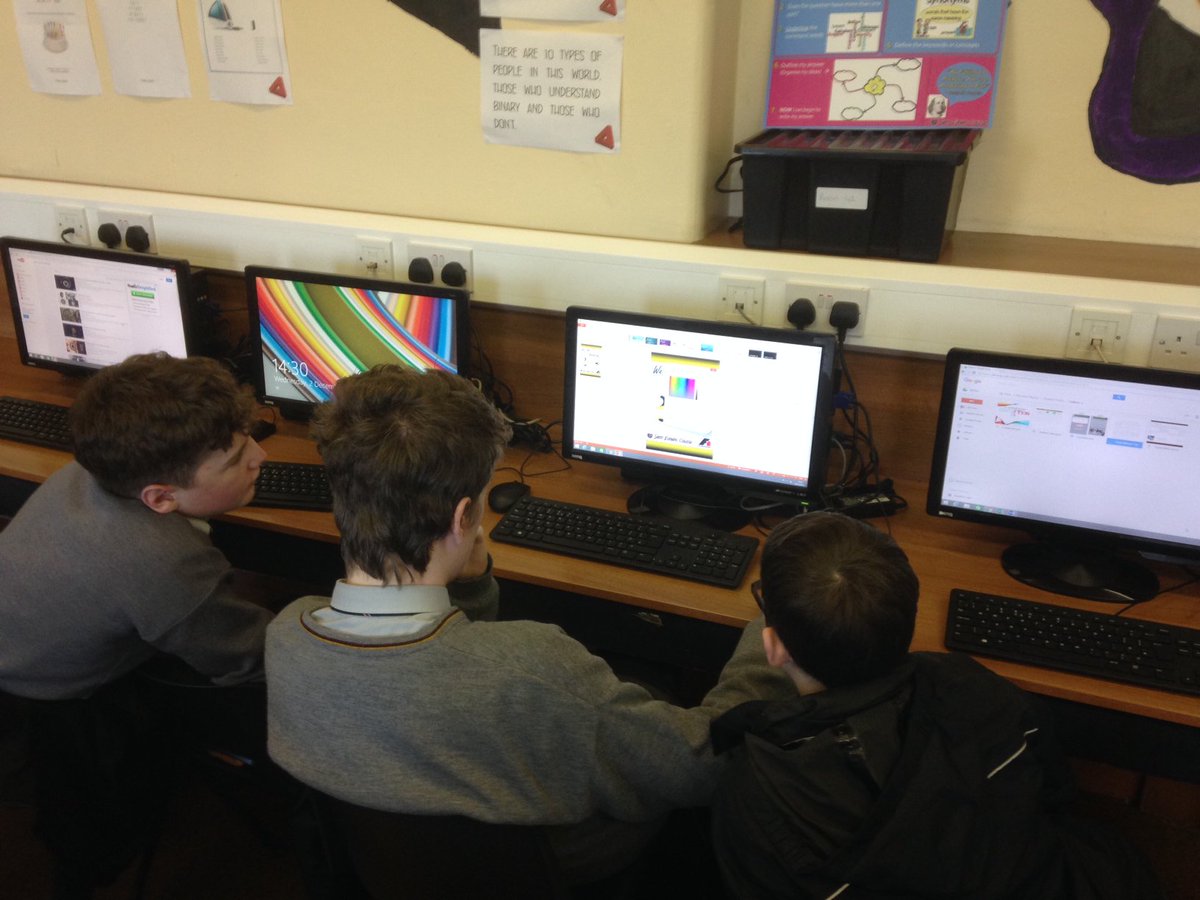 Everyone working on designing a team poster