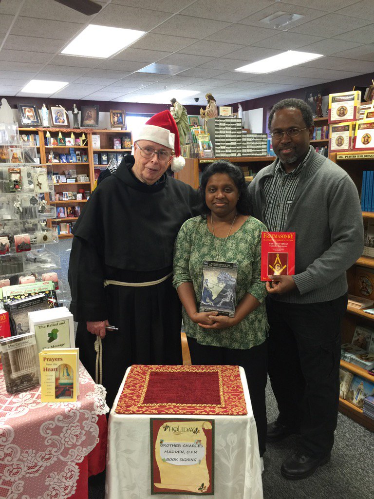 Br. Charles Madden OFM Conv. with patrons at the Marytown Gift Shop.