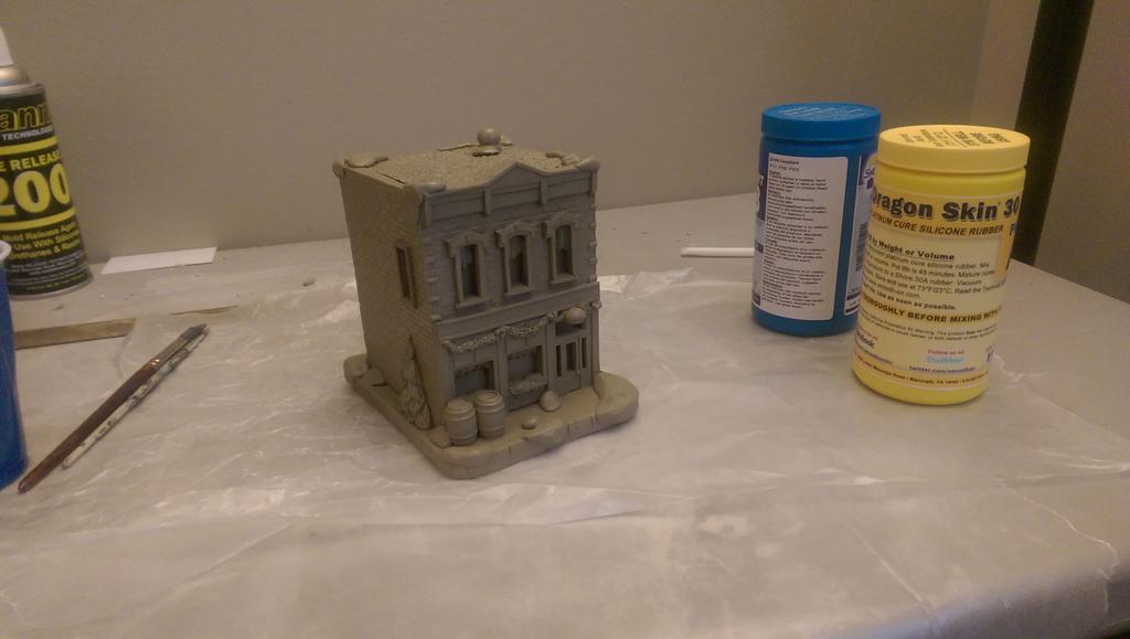 CreatureBuildrs's tweet image. 2015 Christmas village sculpture. Casting the first one out of the mold this afternoon.