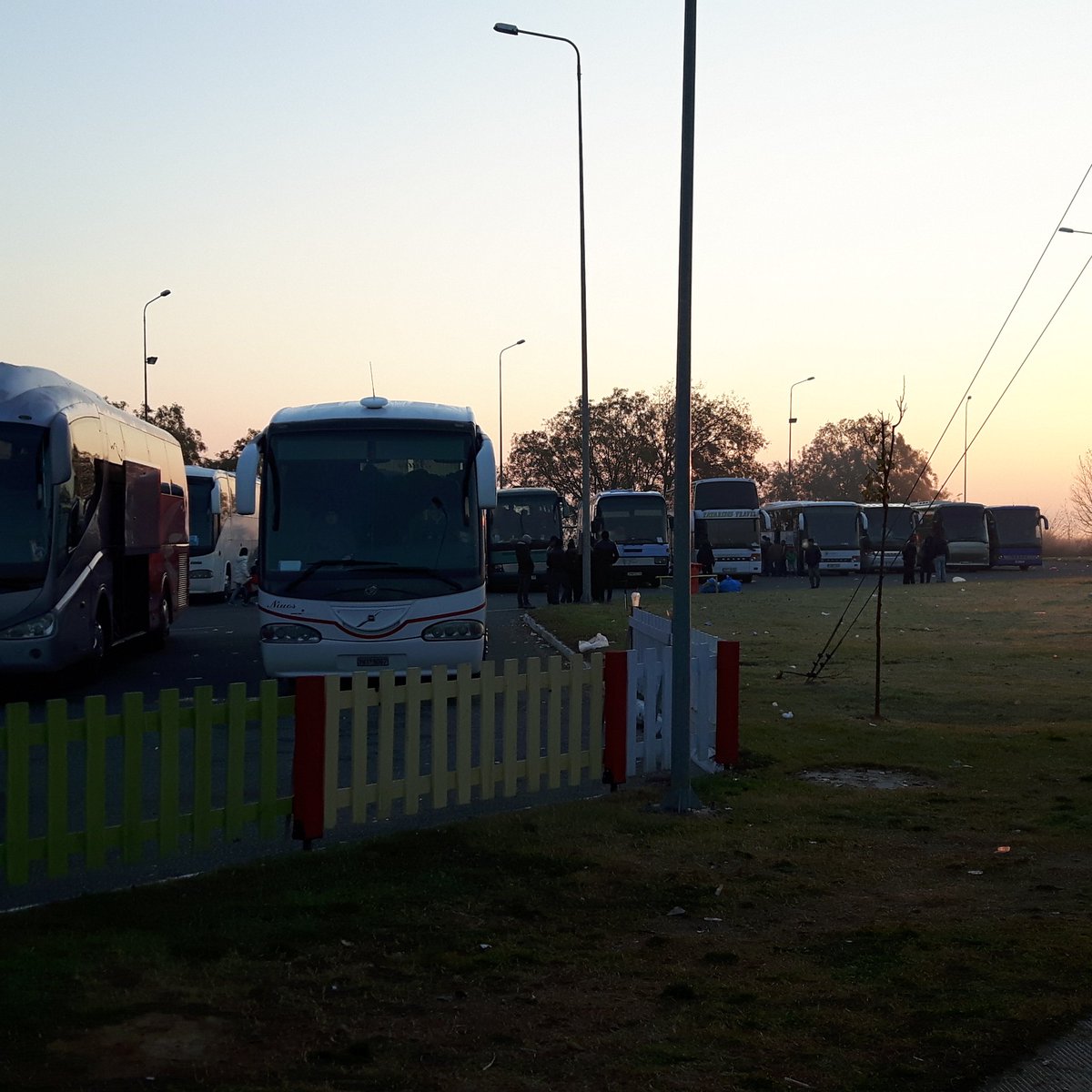 On my way to the Greece-FYR Macedonia border.30+ buses with refugees at this car park alone #refugeesgr #soseurope