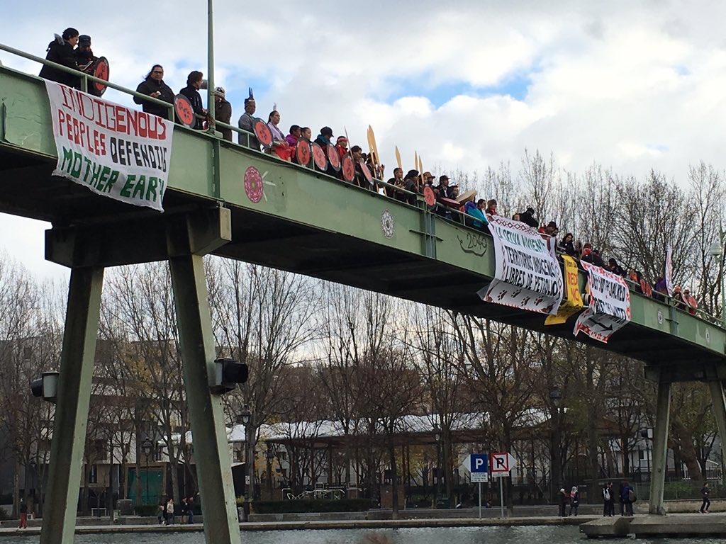 350's tweet photo. "Indigenous people defending Mother Earth" drumming ceremony on bridge #Paris #Canoes2Paris @IENearth @IdleNoMore4 https://t.co/3xsoD4yoxI