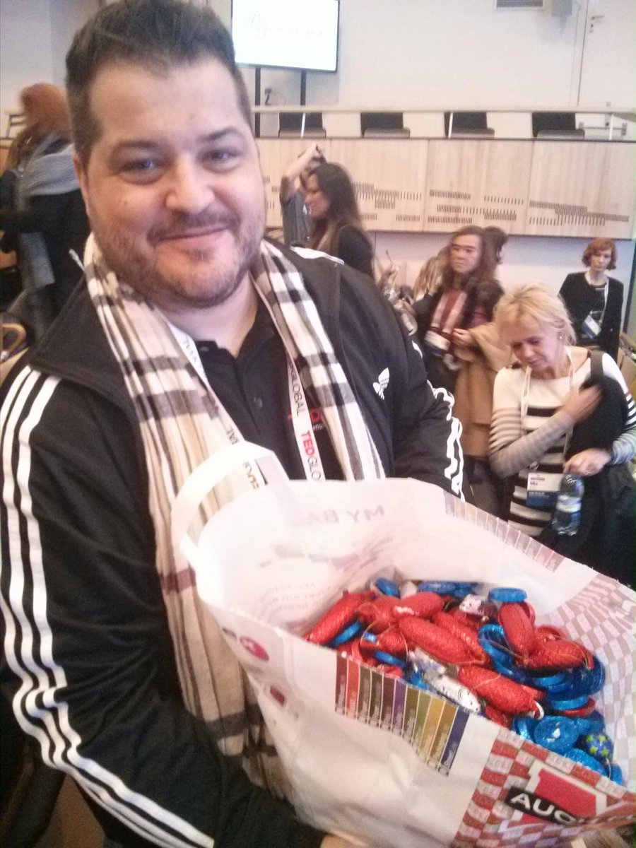 Markus from <a href="/tedxbern/">TEDxBern</a> handing out Swiss chocolates from a huge bag. Hero! #TEDGlobal