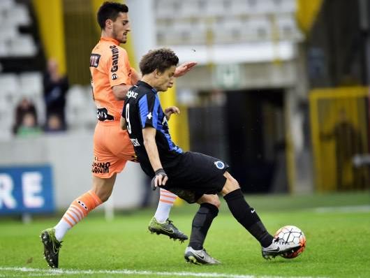 Zajkov defends a Club Brugge player Zajkov defends a Club Brugge player