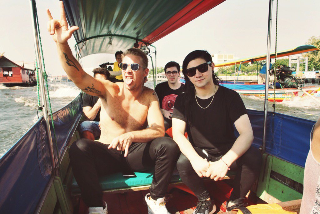 Skrillex's tweet image. Riding a boat across Thailand