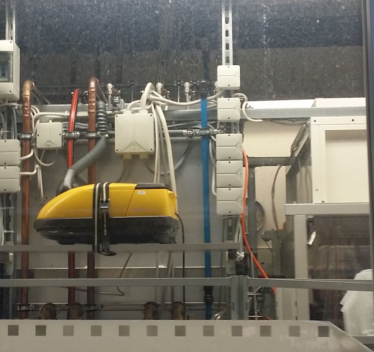jwiechers's tweet photo. "Yes, officer, that's a vacuum cleaner; Bob makes sure it runs whenever our machines run." #NoOSHA #wtf https://t.co/rJl1kFI9pC