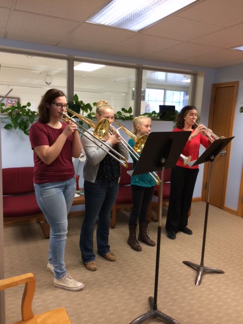 Madisyn, Mackenzie and Racquel play for the Superintendent's Office in preparation for the holiday concert.