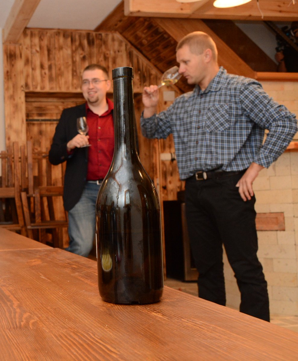 furmintUSA's tweet photo. Behind the dry #Furmint bottle #Majoros is giving a sniffy-sniff. Next to him the Project Director Balázs is smiling https://t.co/swD404OXou