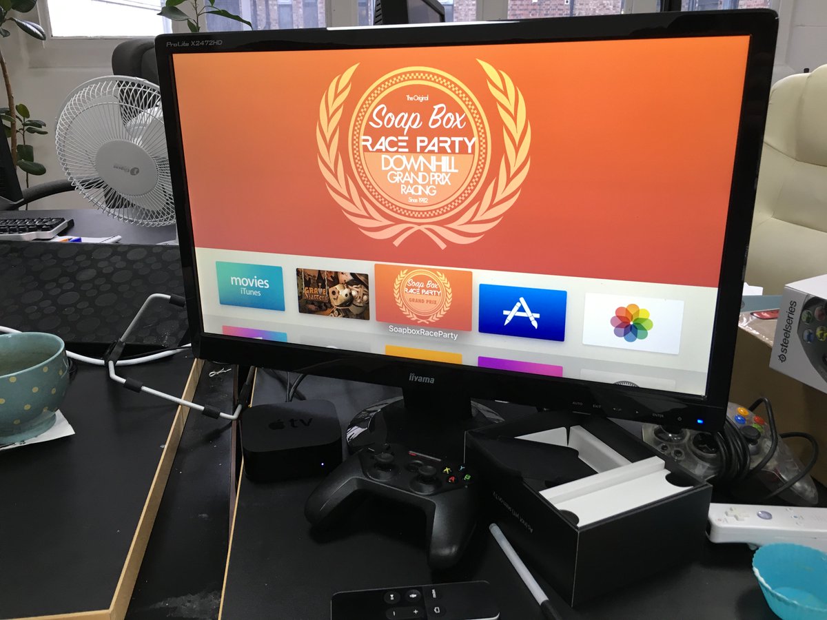 soapboxracegame's tweet photo. Balancing an #AppleTV Remote, a Nimbus Controller &amp; iPhone (both tilt and touch steering) is challenging! #indiedev https://t.co/h2xQBsRyO1