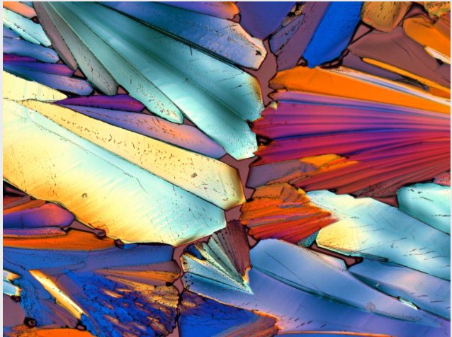 Stunning polarized-light photomicrograph of a crystallized drop of Aperol! On <a href="/NatGeo/">National Geographic</a> proof.nationalgeographic.com/2015/12/04/pho…