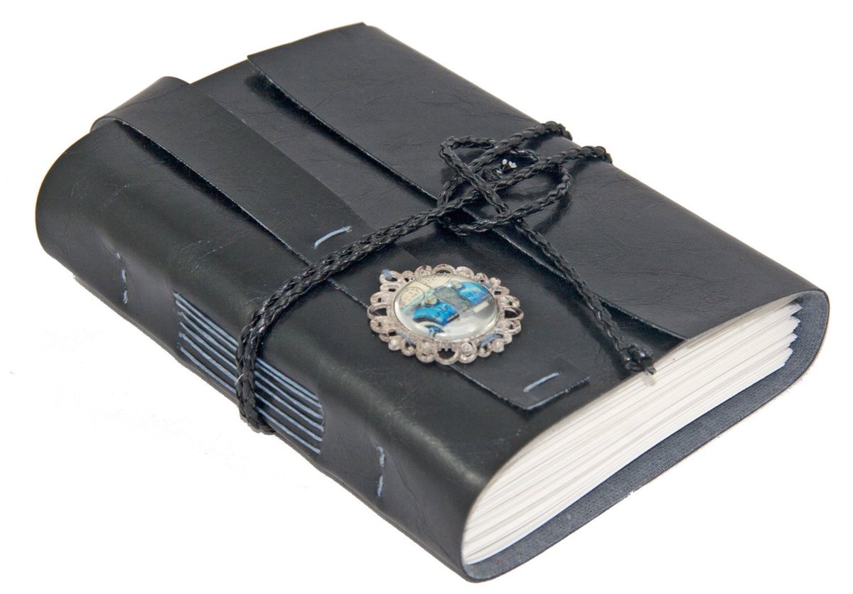 BoundByHandUS's tweet photo. Black Faux Leather Journal with Vintage Car Cameo and Bookmark https://t.co/6FvCKUMQpJ #boundbyhand #WrapJournal https://t.co/Krry5GgY55