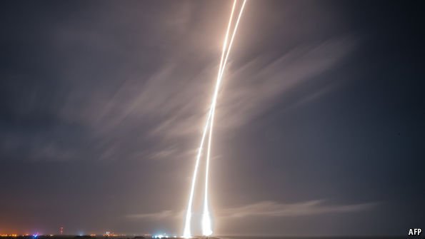 TheEconomist's tweet photo. Elon Musk’s early Christmas present to himself—and the world—is a reusable rocket https://t.co/PXX0cnscVJ https://t.co/E7EryYGRgC