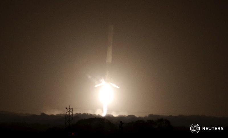 Reuters's tweet photo. PHOTOS: This is how the SpaceX Falcon 9 rocket nailed its landing in a spaceflight first. https://t.co/Hxf7dwklsN