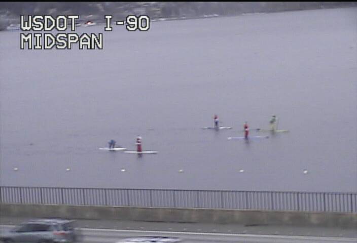 wsdot_traffic's tweet photo. More than a 1/2 dozen Santas are currently paddling across Lake Washington on the south side of I-90 right now! https://t.co/Vs7ZzvbBV3