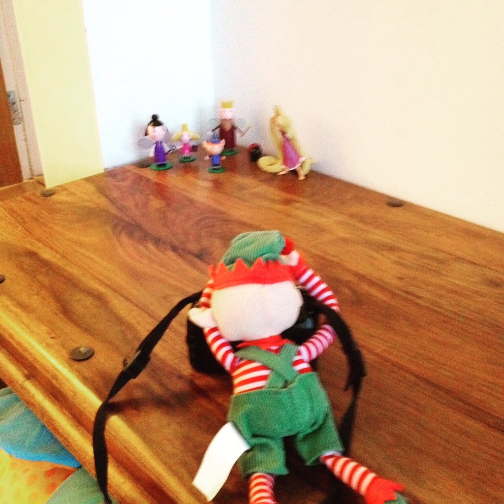 Day 23, Mr Elfie making sure he has pictures of his friends to take back to Lapland #elfonashelf