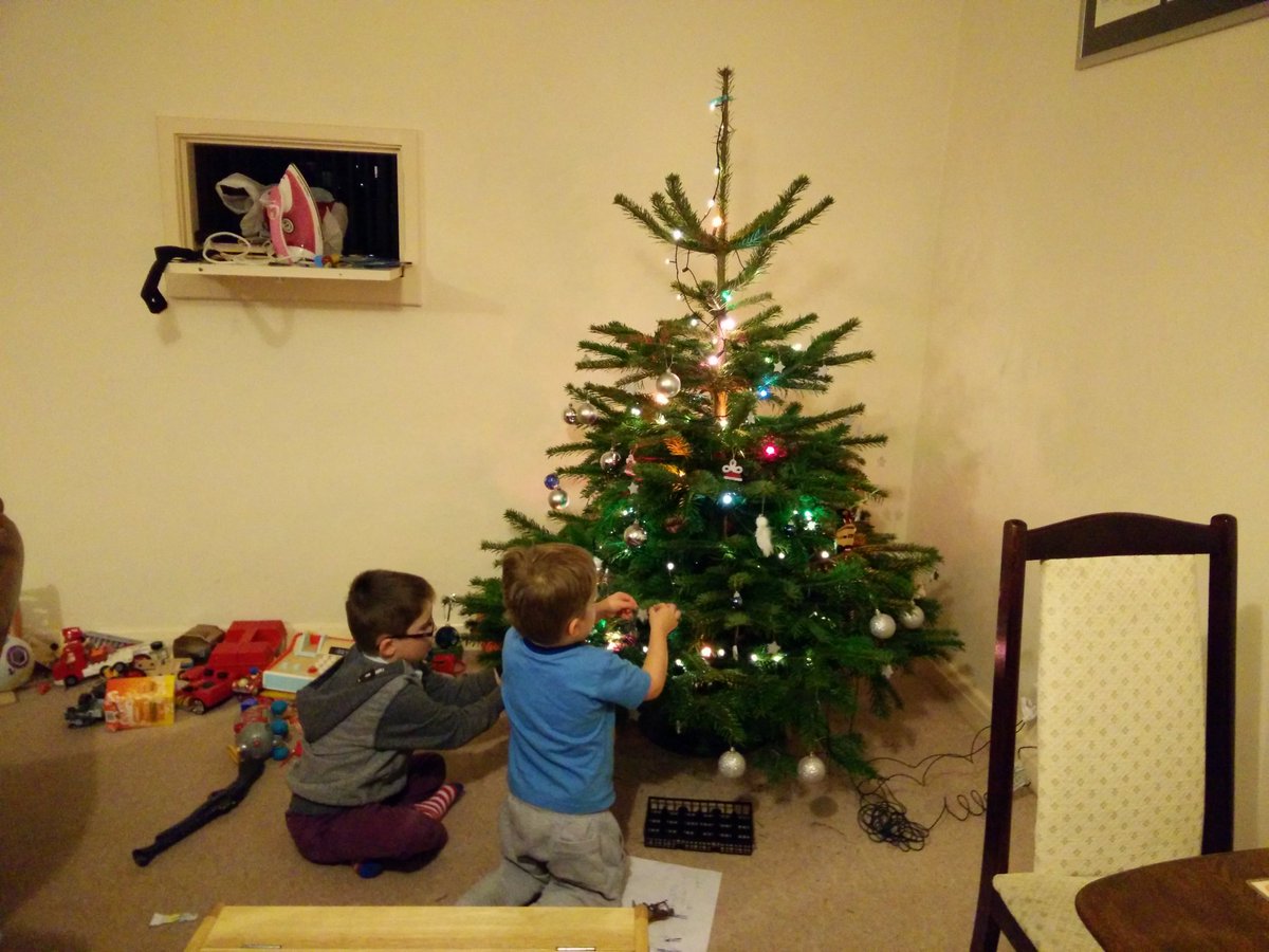 AlexFielder's tweet photo. Two cheeky elves hard at work decorating the tree: #NeverMindTheMess https://t.co/WZTiyzB5ob