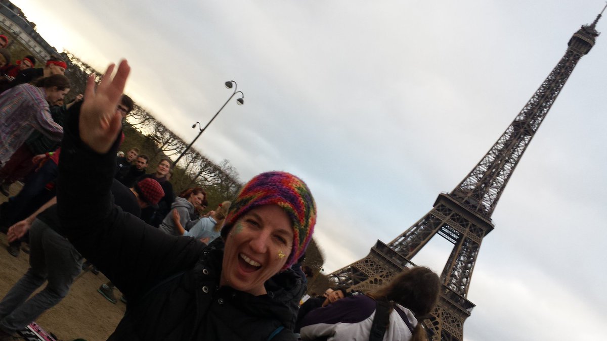 lacymacauley's tweet image. "Climate Justice Now!" is the chant from crowd at small music show to side of man event, Eiffel Tower. #D12 #COP21