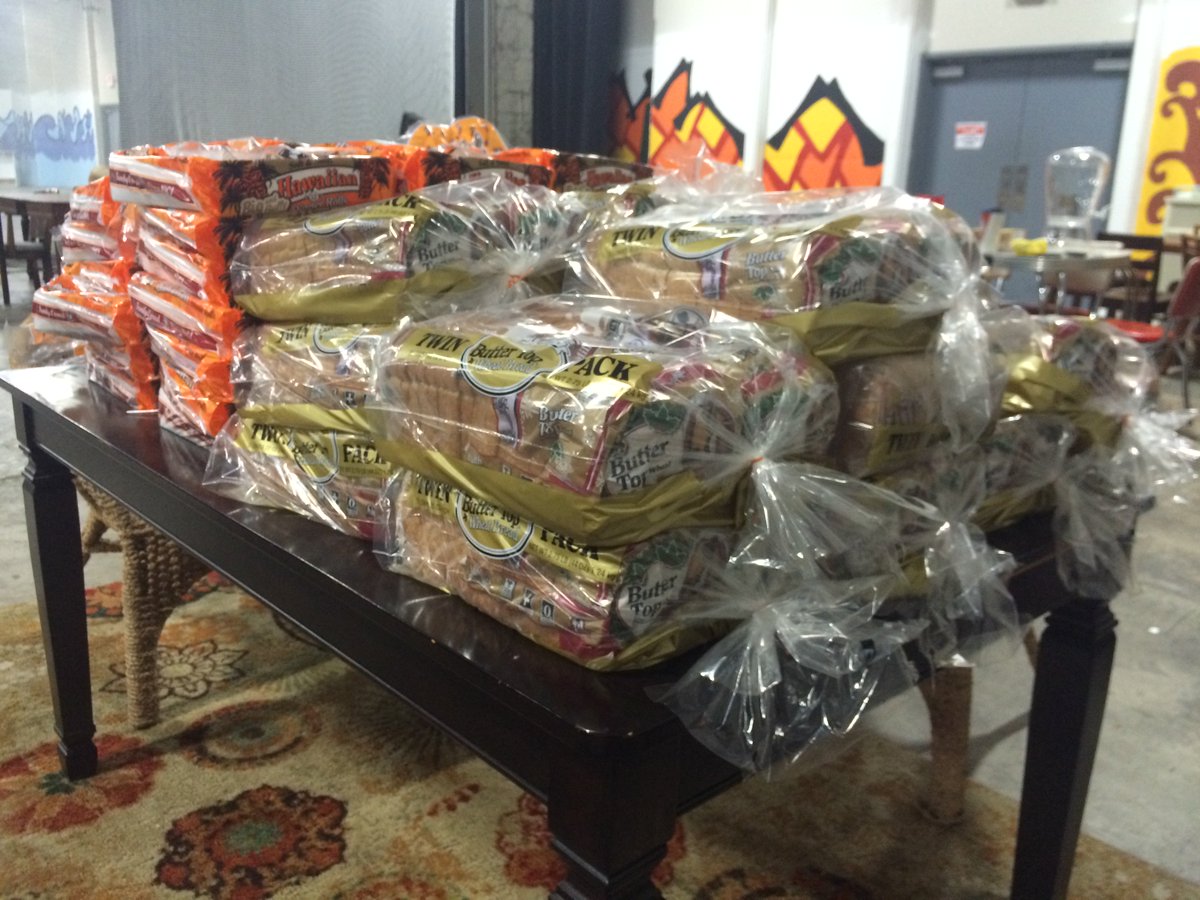 1525Warehouse's tweet photo. Thanks to Anthony and Erica Lewis for donating this mountain of bread for the party tonight! #donors #christmas2015 https://t.co/MNrJjqbdru