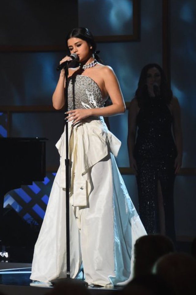 gomezgrandeomg's tweet photo. the ghost of demi in the background https://t.co/ws7xvgd9to