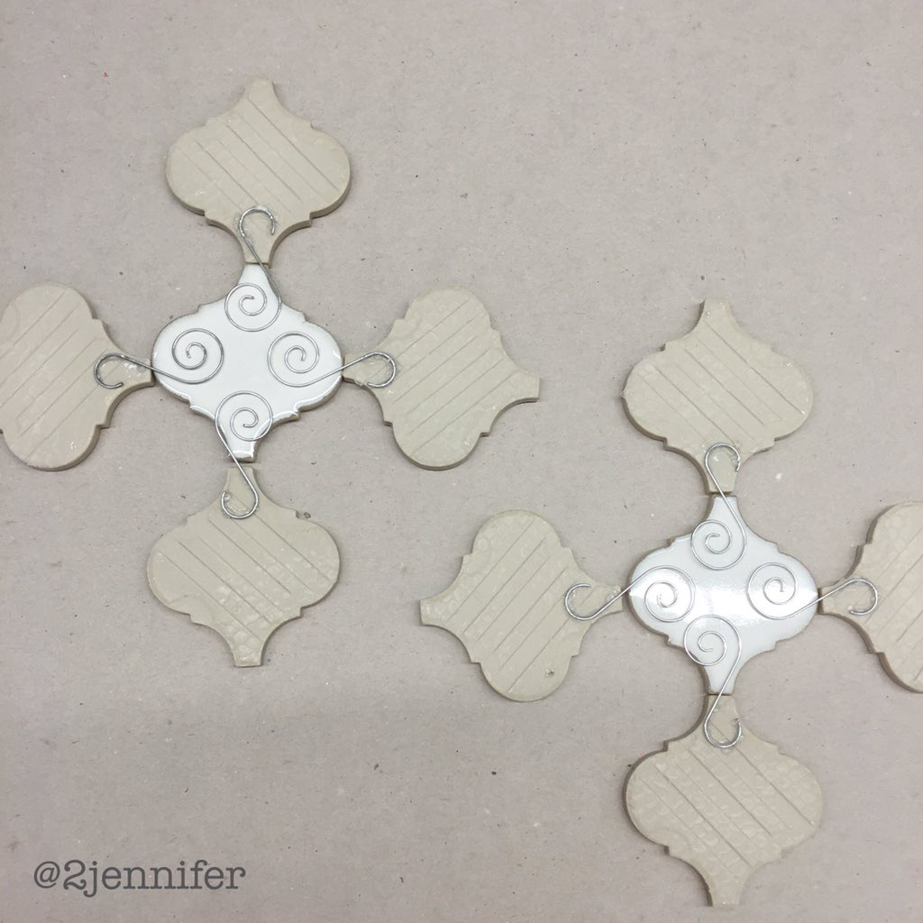 Gluing ornament hangers to the back...