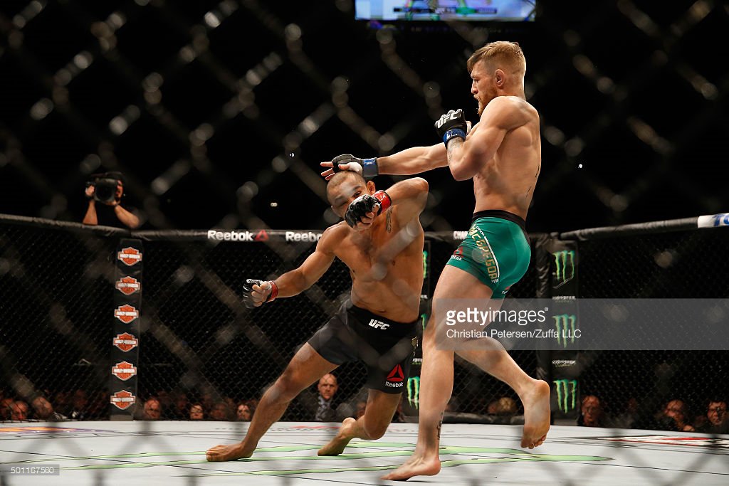 GettySport's tweet photo. Boom! In just 13 seconds Conor McGregor knocks out Jose Aldo to become featherweight champion. #AndNew #UFC194 https://t.co/wqylCENU8s
