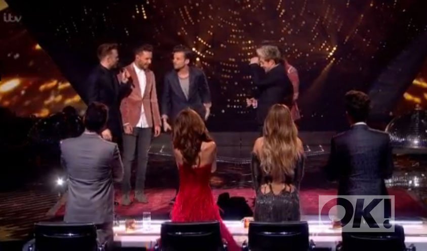 OK_Magazine's tweet photo. Viewers question AGAIN if Harry Styles has a restraining order against Caroline #XFactor: https://t.co/Tzv2rXMElo https://t.co/F1CvhfswOK
