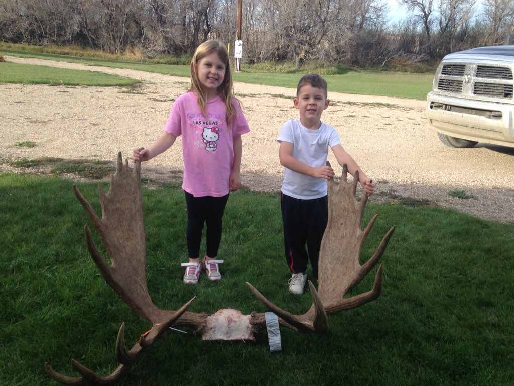 Kids with daddy's moose.