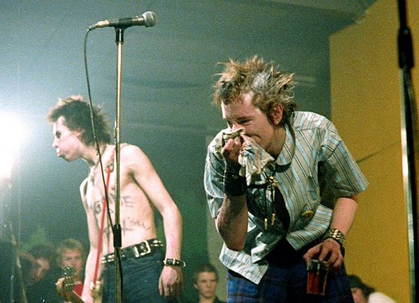 Johnny Rotten and Sid Vicious on stage.