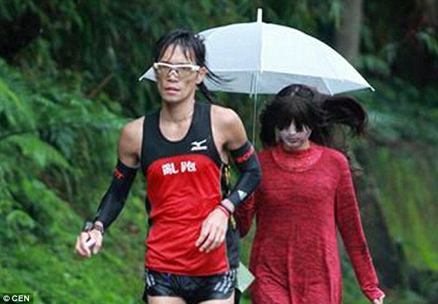 DailyMail's tweet photo. Taiwan marathon organisers hired a 'female ghost' to scare contestants into running faster https://t.co/rK8RvuUCBQ https://t.co/yrS48ww6Yz