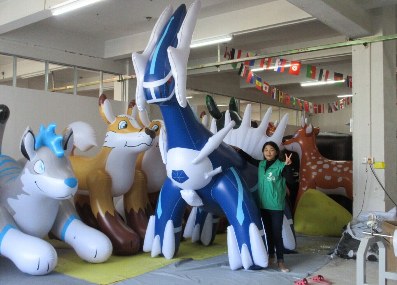 Giant chubby shiny inflatable lugia-looking dragon, standing above