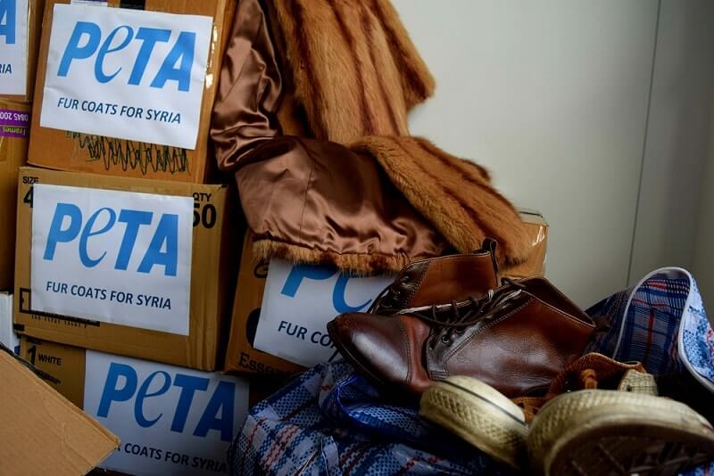 peta's tweet photo. Freezing refugees in #Syria receive unwanted fur coats donated by kind people &amp; @PETAUK. https://t.co/JgRgLW3k66 https://t.co/jOBnOwxZkr