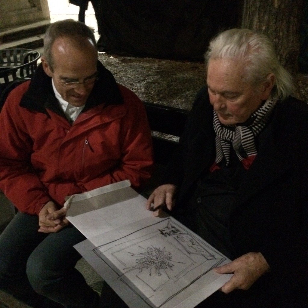 Ingo looking at a sketch of a display, on Piazza Sant'Eufemia, Milano, together with team member Michel Sempels