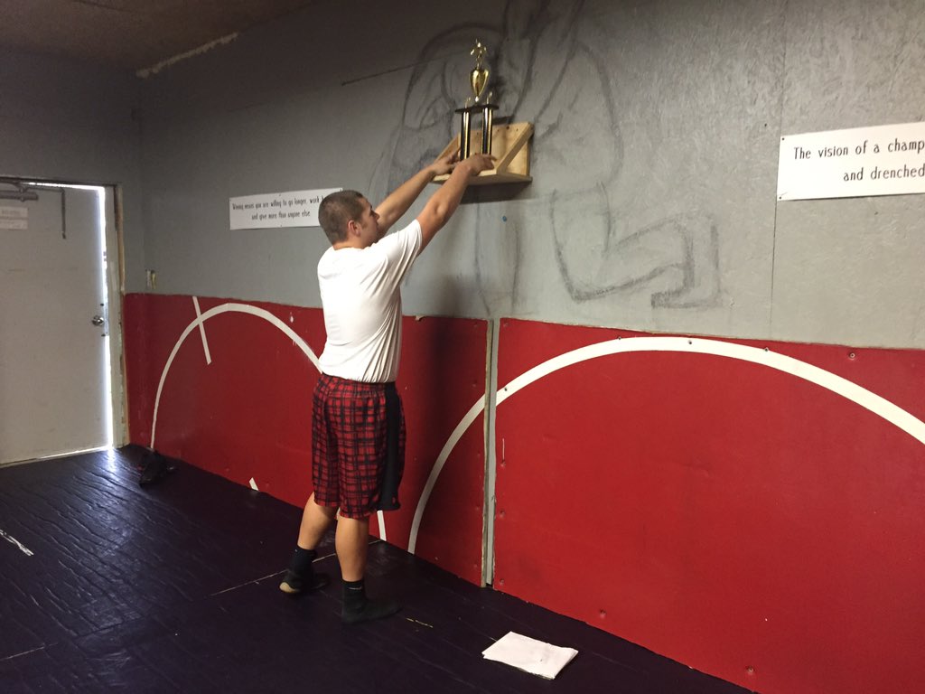 jcmlandgrain's tweet photo. Gunnar puts up our TEAM trophy in the SE Wrestling Room!👍🏻😀. @thetrojanwall https://t.co/msJgtNmZoF