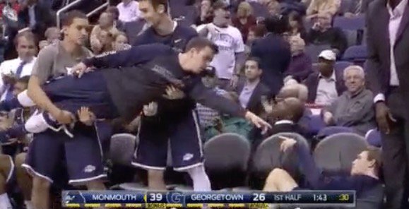 BleacherReport's tweet photo. Monmouth bench actually busts out the Sistine Chapel celebration vs. Georgetown https://t.co/jZifW4kRQN https://t.co/IkIloBRAHl