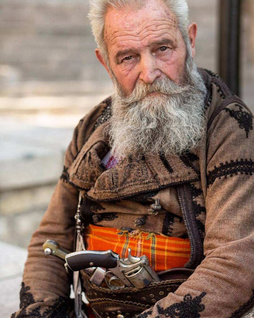 IntoOutdoors's tweet photo. Photo by @argonautphoto (Aaron Huey). At a #BulgarianWedding a traditional bagpipe player wears a knife and pistol.… https://t.co/txzzf5Mi1j