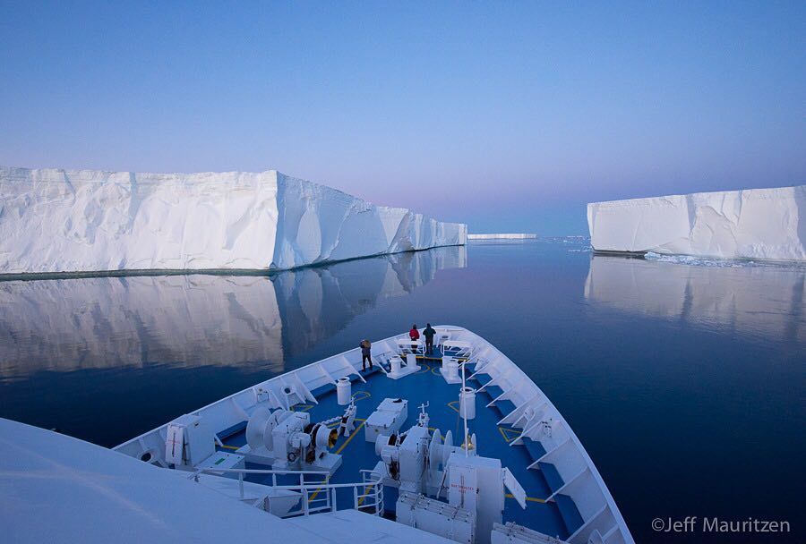 IntoOutdoors's tweet photo. Imagine standing on the bow of a ship as it glides past immense tabular icebergs under the midnight sun. No wind, s… https://t.co/pxKVJK9DJL