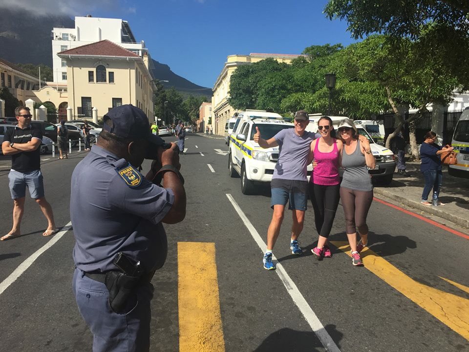 Police officer shooting #ZumaMustFall protestors.