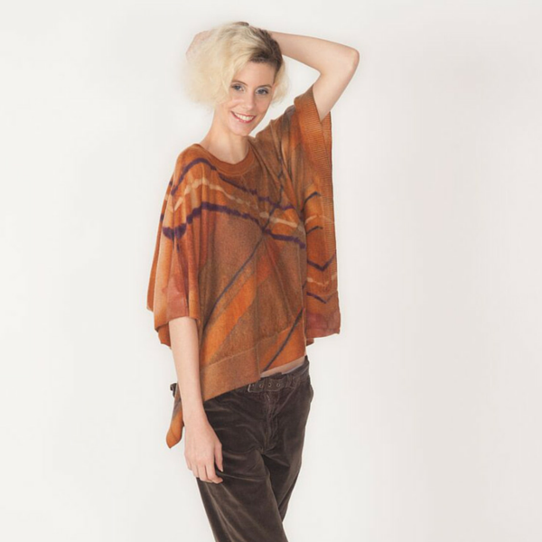 MAtCHcollection's tweet photo. Our argyle, rust cashmere poncho. Warm, fashionable and Made in the USA. Shop: https://t.co/n7InuVNxC8 https://t.co/r6yDJdgxLa
