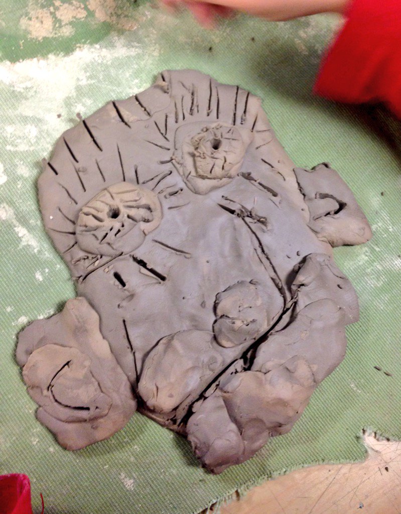 Kindergarten is beginning to work on clay self portraits- look at the different styles!