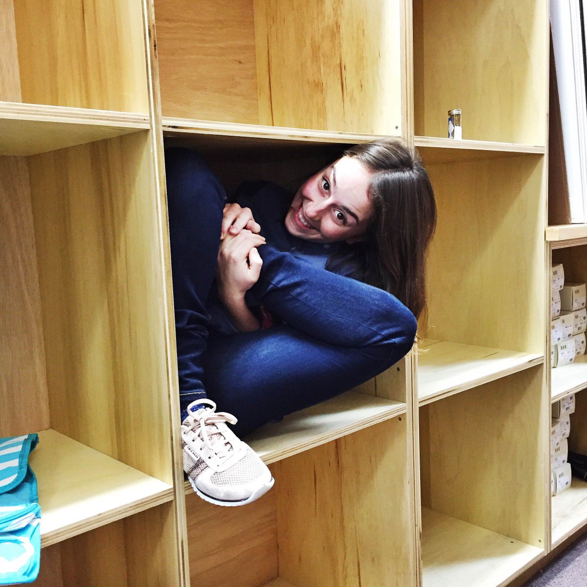 What is the first thing we think of doing after clearing out some storage cubbies? Seeing if Julia can fit in one!
