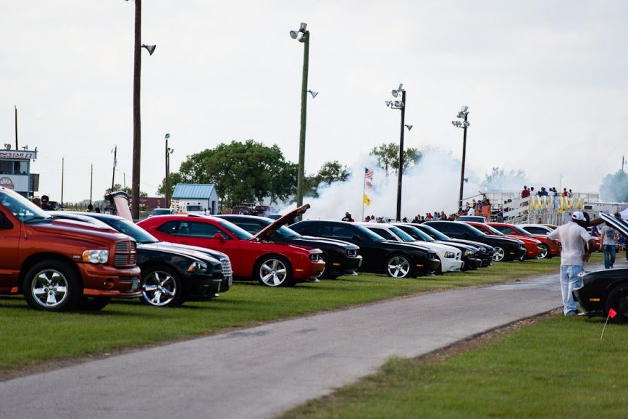 LSMoparFest's tweet photo. #TBT to #LSMF2012 show field and burnout smoke in background https://t.co/3DXZDbtTGx