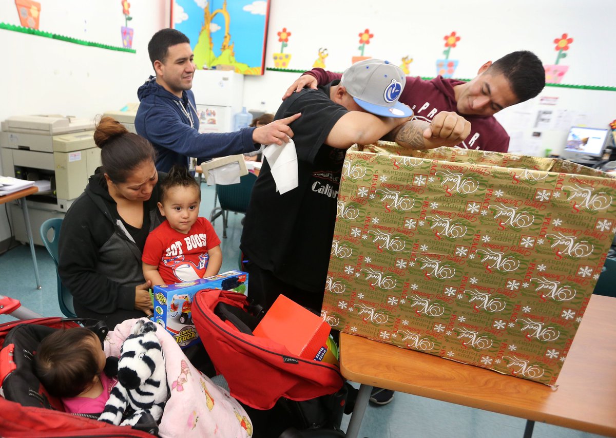 CalStateLA's tweet photo. Family overcome by emotion when receiving toys&food from #CalStateLA EPIC @ Anton School. #CalStateLACares #GOEastLA https://t.co/QaVQHu4wFm