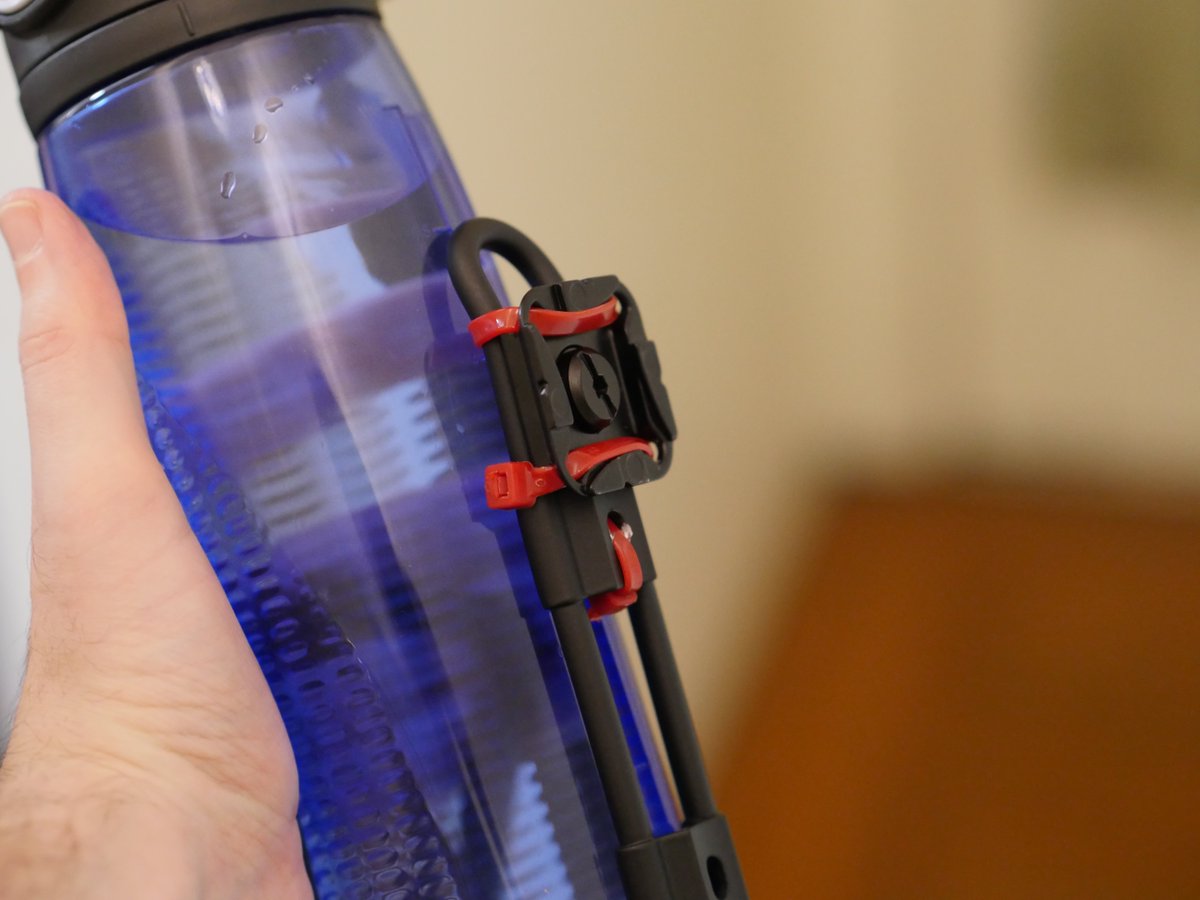 abic's tweet photo. @imatinyrockstar it's just a bike water bottle holder zip-tied to a capture plate. https://t.co/AcDzIPb4kB