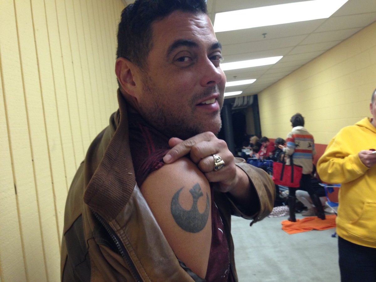 Danny Kemp shows off his tattoo in the line at AMC Marina Pacifica in Long Beach.